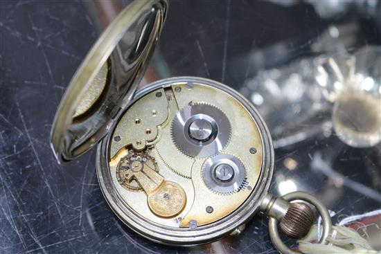 An M M & Co Goliath pocket watch and a travelling clock movement (lacking case).